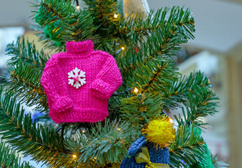 Small knitted sweaters as a decoration for the Christmas tree.