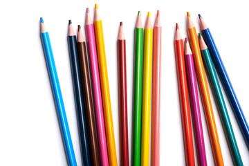 Colored pencils isolated on a white background, a place for advertising.
