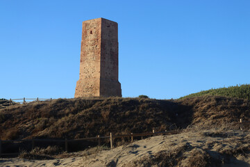 Fototapeta na wymiar Torre ladrones, watchtower on Cabopino beach in Marbella