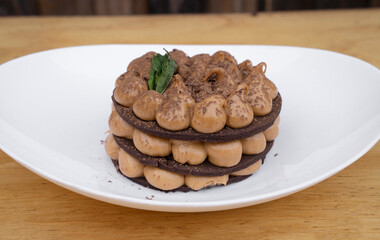 Chocotorta. Closeup view of a cake made with chocolate cookies and dulce de leche cream, in a white dish. 