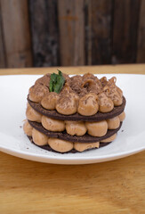 Chocotorta. Closeup view of a cake made with chocolate cookies and dulce de leche cream, in a white dish.