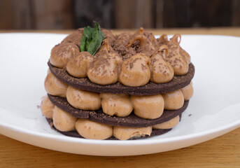 Chocotorta. Closeup view of a cake made with chocolate cookies and dulce de leche cream, in a white dish.