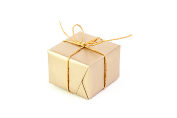 Gift box with bow isolated on white. Wrapped Christmas or birthday golden color gift box. Single present