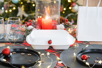 Food delivery service containers on table, festively served for the celebration of Christmas and new year. Tableware and loft-style decor. Saving time, hot order, disposable plastic box. mock up
