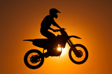 Obraz na płótnie Canvas silhouette of biker