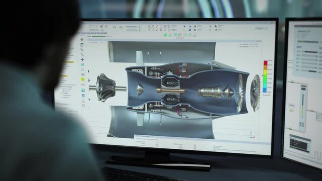 Specialist Observes Components Inside Turbine Engine In Project Production Program. Engineering Specialist Uses CAD Software To Make Turbine Project. Specialist Creating Prototype Turbine Project