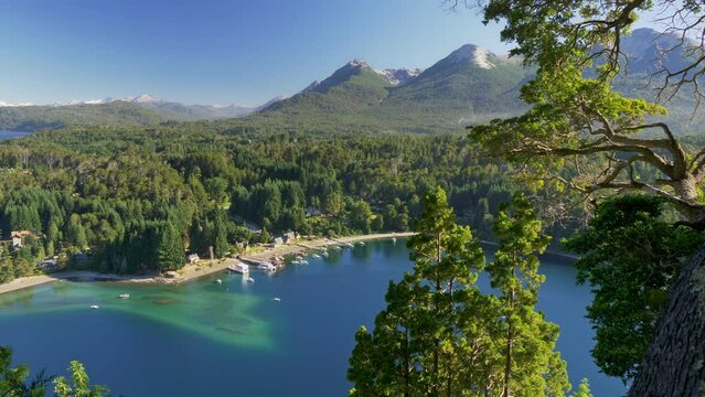 Villa La Angostura, Argentina, Patagonia, Lake district. Blue bay, green trees and mountains. UHD, 4K