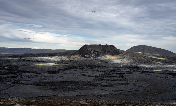 Helicopter flying over Fagradalsfjall volcano and lava field at Reykjanes, Iceland. Huge lava field from an eruption in 2021
