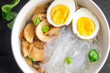 asian soup rice noodles funchose, egg, mushrooms Pho Bo meal food snack on the table copy space food background rustic top view