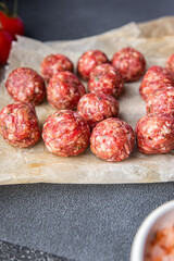 fresh meatballs raw meat pork, beef, lamb meat balls snack meal food on the table copy space food background rustic top view