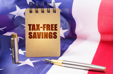 Against the background of the American flag is a notepad with the inscription - tax-free savings