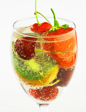 Fruit in a glass of fizzy water