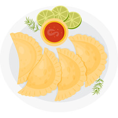 Mexican Empanadas on plate with sauce, lime slices