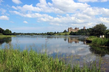 Linlithgow Palace and St Michael's Church, with Linlithgow Loch in the foreground.