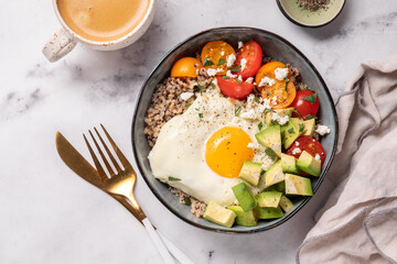 Keto diet plate quinoa, avocado, egg and tomatoes. Healthy food, ketogenic diet