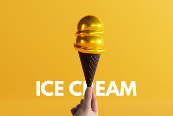 Hand holds gold ice cream in a black waffle on the ground and yellow background. The concept of...