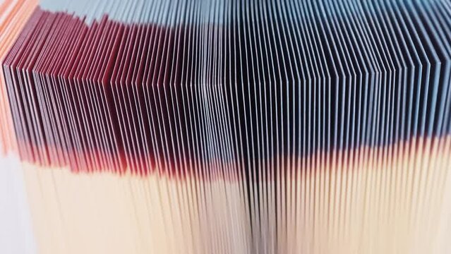 Edge of colorful open book pages with blurred background