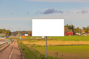 Close up view of motorway with road billboard with mockup image blank screens. Sweden.