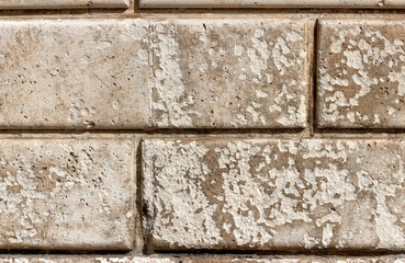 Old concrete wall with geometric pattern for use as a background texture