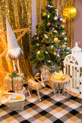 New Year location for family photos with decorated Christmas tree, garland, gifts and elf