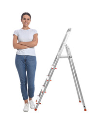 Young woman near metal ladder on white background