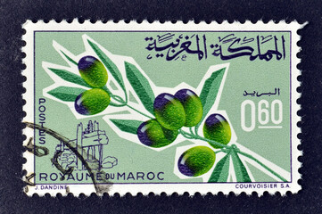 Cancelled postage stamp printed by Morocco, that shows Olive branch with fruits, old oil press,...