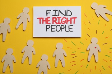 Find the right people. Human paper figure with drawn heart among others without it on yellow...
