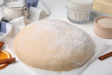 Fototapeta na wymiar Fresh dough and ingredients on white table, closeup