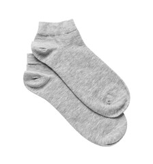 Pair of grey socks on white background, top view