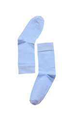 Light blue socks on white background, top view