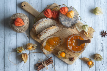 Tasty, fragrant jam and physalis fruits on the table.