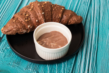 Sweet chocolate croissant and chocolate sauce