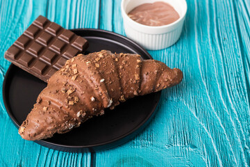 Croissant with chocolate bar and chocolate spread