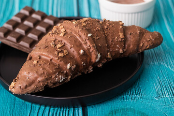 Croissant with chocolate bar and chocolate spread