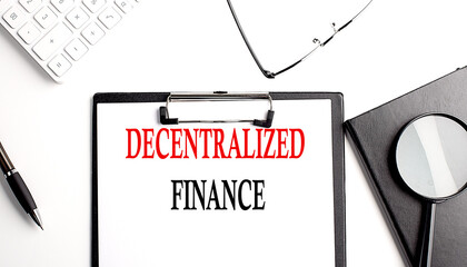 Decentralized Finance text written on paper clipboard with office tools