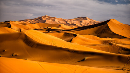 Sahara Desert sand dunes background. Popular travel destination, Erg Chebbi, Sahara Desert, Morocco. - obrazy, fototapety, plakaty