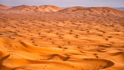 Sahara Desert sand dunes background. Popular travel destination, Erg Chebbi, Sahara Desert, Morocco.