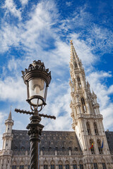 Fototapeta na wymiar Spire of the Brussels Town Hall building in the Grand Place in Brussels, Belgium