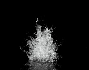Water splash isolated on black background.
