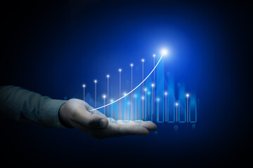 A businessman's hand points to a growth chart with symbols. Growth strategy and goal achievement