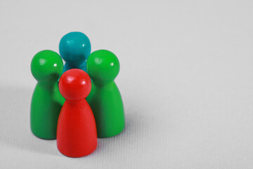 Colorful pawns on light grey background, closeup with space for text. Recruiter searching employee