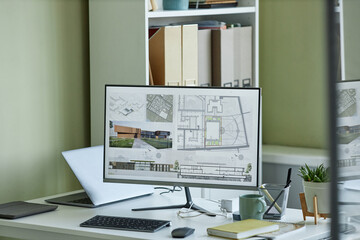 Close up of computer with 3D blueprints on screen, architects workplace, copy space