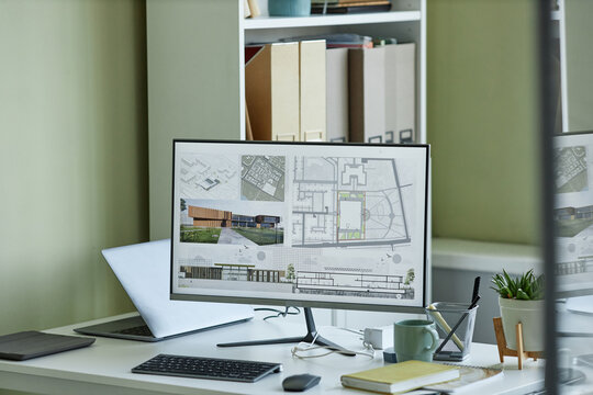 Close up of computer with 3D blueprints on screen, architects workplace, copy space