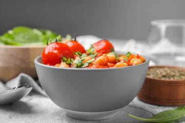 Delicious chickpea curry in bowl on table, closeup