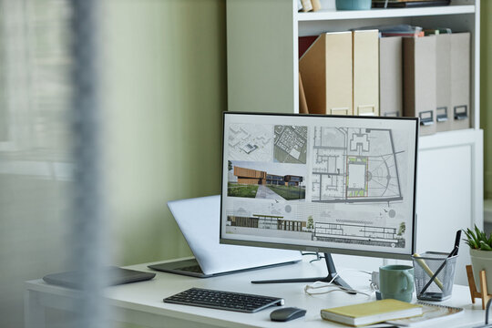 Background image of architects workplace, computer with 3D blueprints on screen, copy space