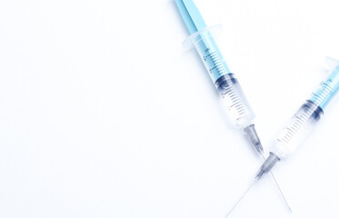 Medical syringe on a white background. A syringe for injection. The concept of health and beauty