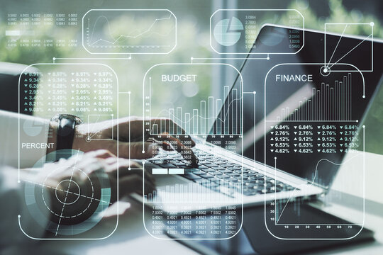 Abstract creative analytics data spreadsheet with hands typing on laptop on background, analytics and analysis concept. Multiexposure - Powered by Adobe
