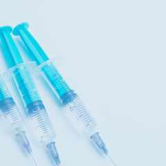 Medical syringe on a white background. A syringe for injection. The concept of health and beauty