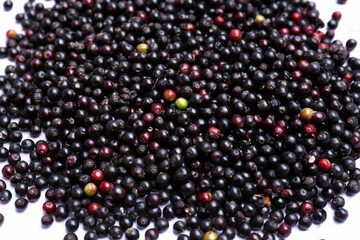 Pile of tasty elderberries (Sambucus) on table, top view