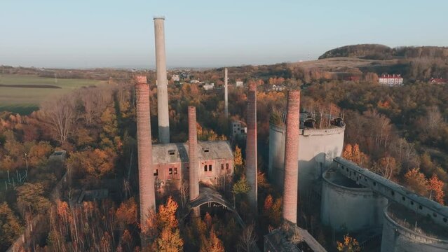 Abandoned old production plant, cement plant in Bedzin, Grodzisk, Poland. Concept of abandoned places, industrial ruins, urbex. View from the drone, air.